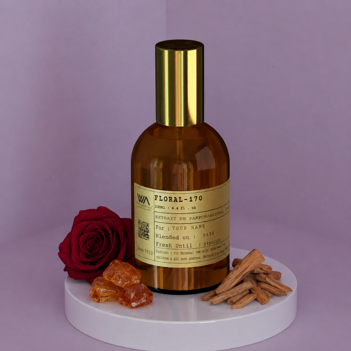A bottle of perfume labeled 'FLORAL-170' with a brown tint and a gold-colored cap, displayed on a white surface against a purple background.