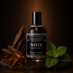 Bottle of 'Noir' perfume with smoking ambiance and candles on a dark surface