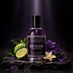 Bottle of 'Suede' perfume by Wanarom on a wooden surface with a dark background